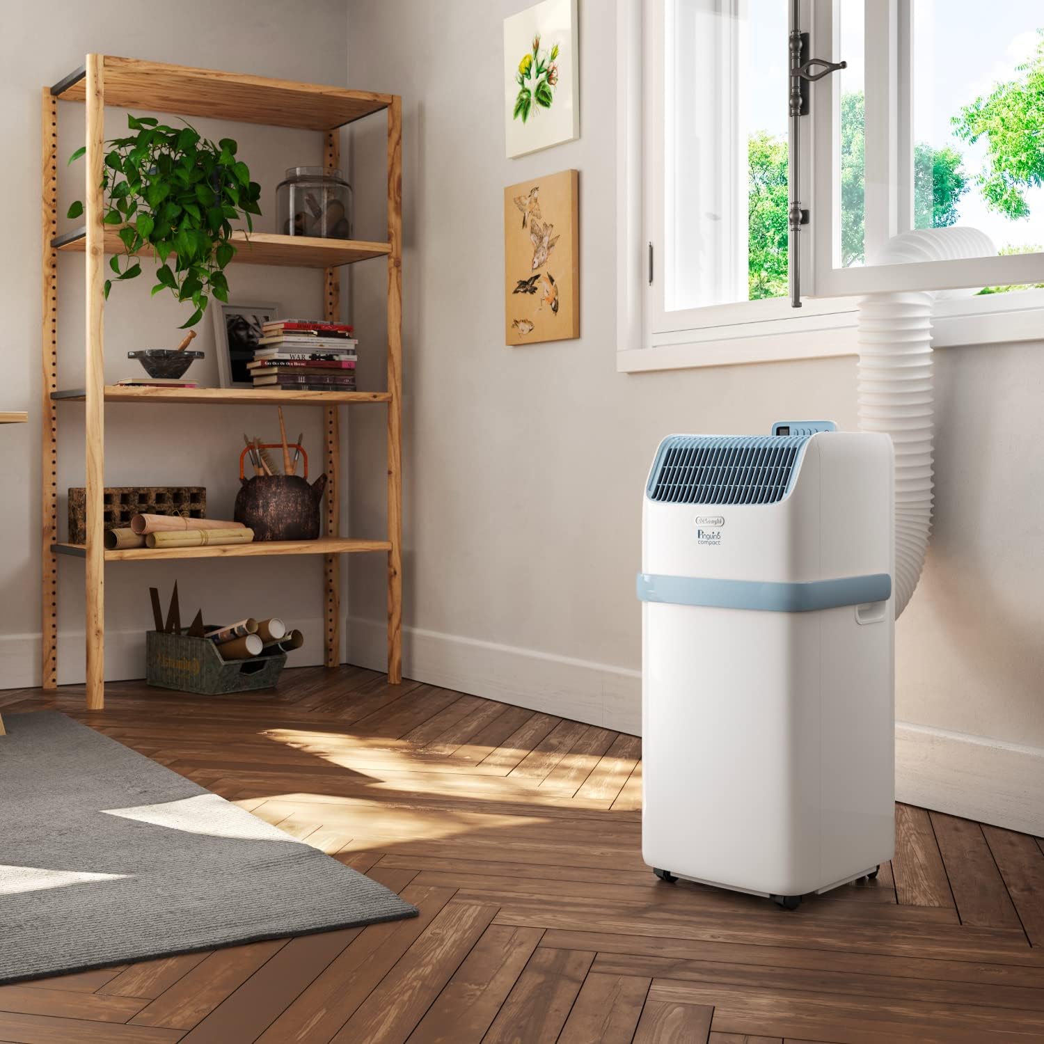 De'Longhi Pinguino - Mobiles Klimagerät, für Räume bis 21,5 m², mit Luftentfeuchter & Ventilator, 8300 BTU, Leiser Betrieb, Fernbedienung, 24h-Timer, Energieeffizienzklasse A (PACES72YOUNG)