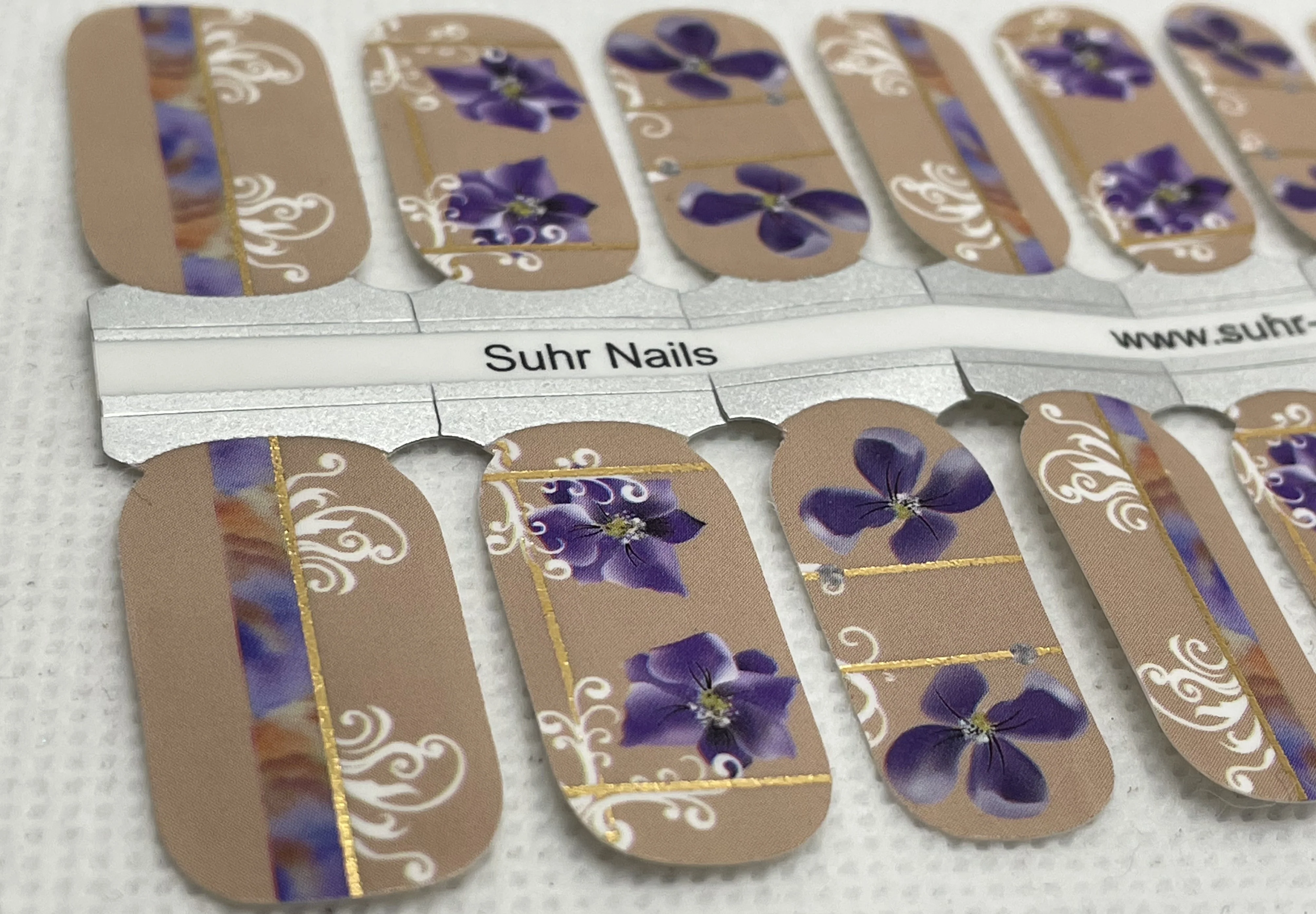 Purple Flowers In Mud