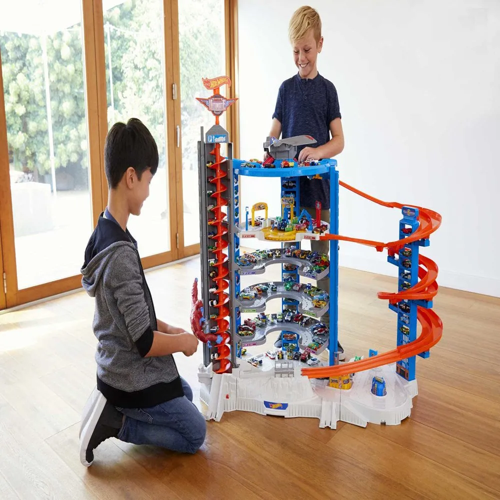 Hot Wheels Track Set with 4 1:64 Scale Toy Cars, Super Ultimate Garage, Over 3 Feet Tall