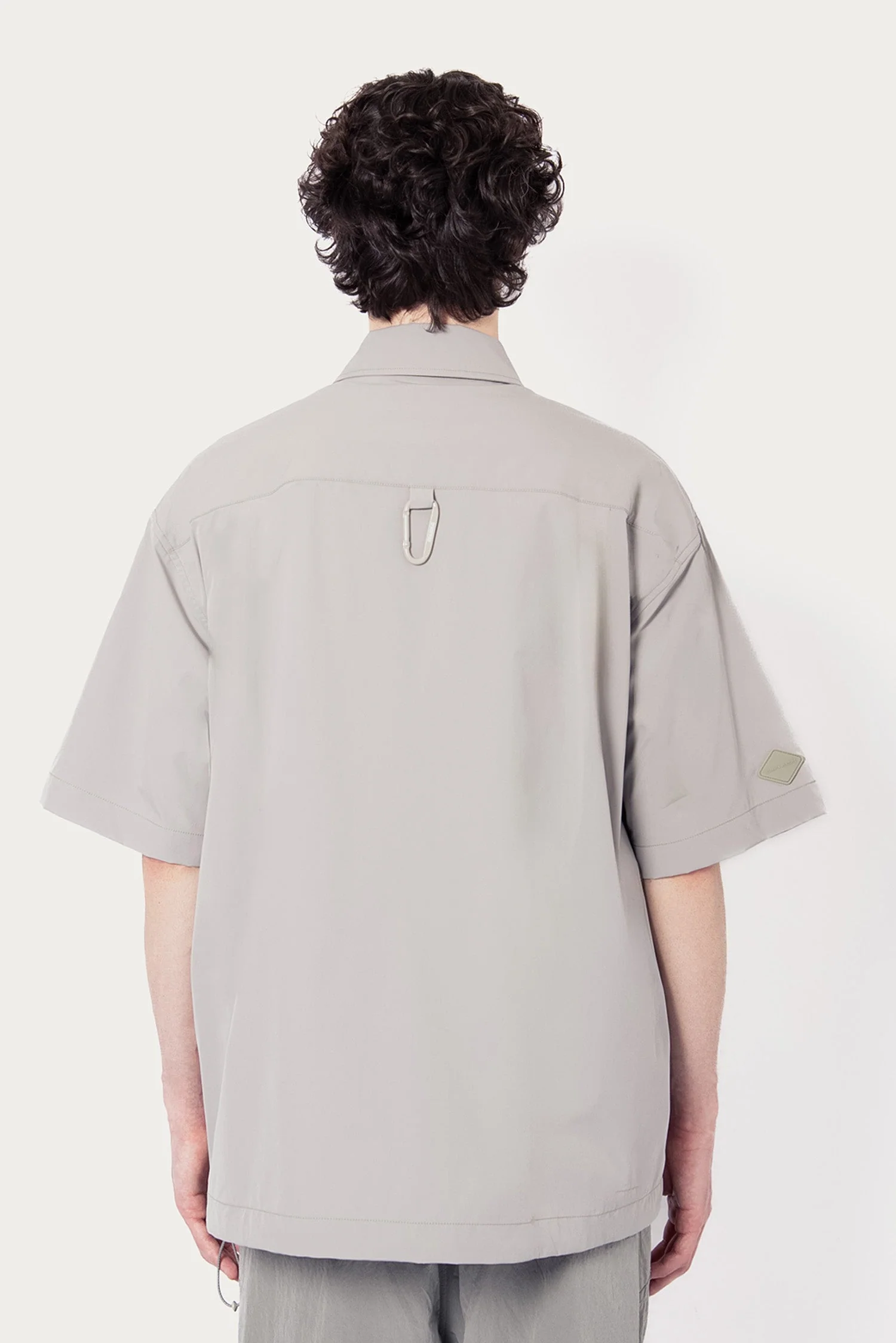 UNISEX SOLOTEX® PACKABLE HALF ZIP POLO