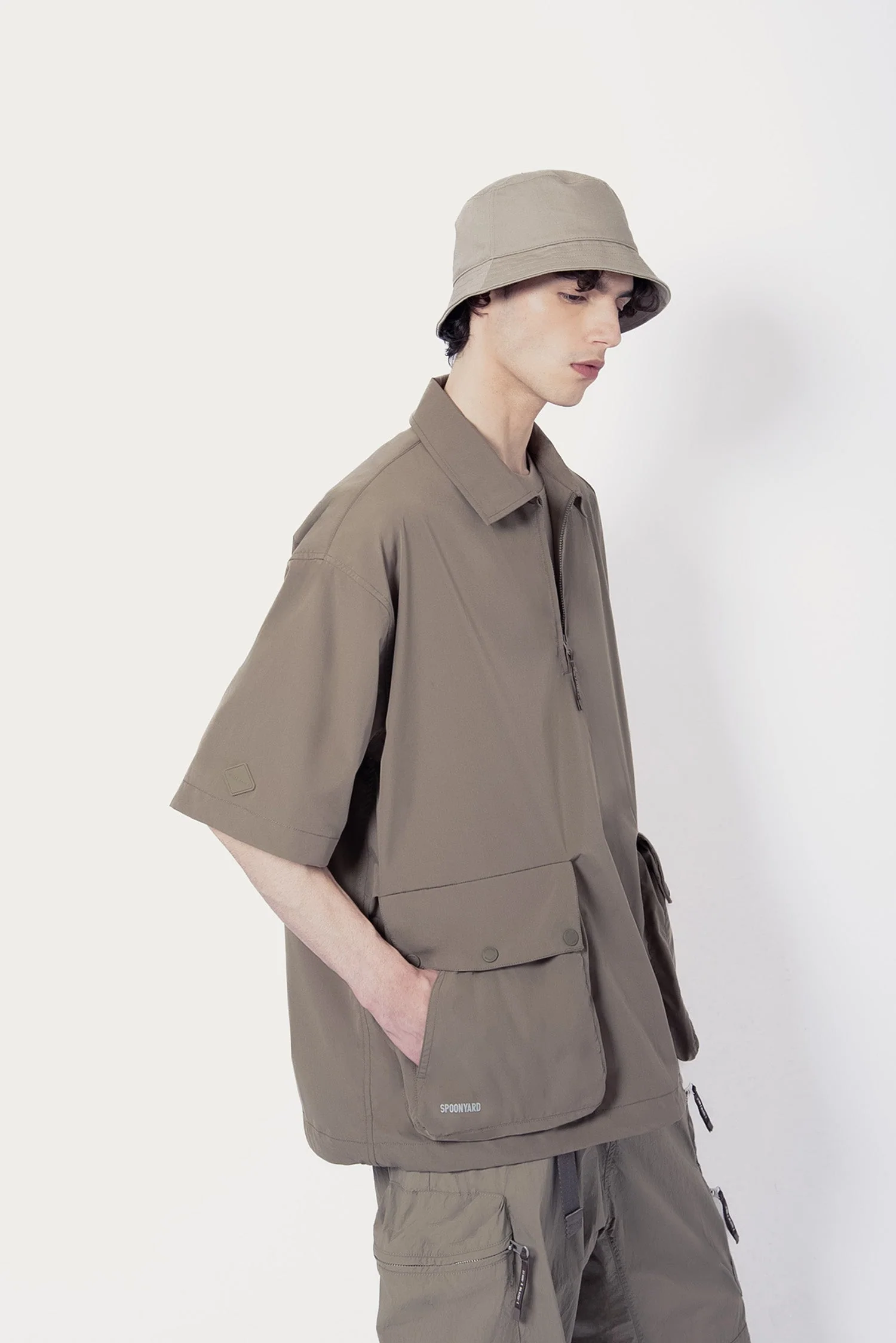 UNISEX SOLOTEX® PACKABLE HALF ZIP POLO