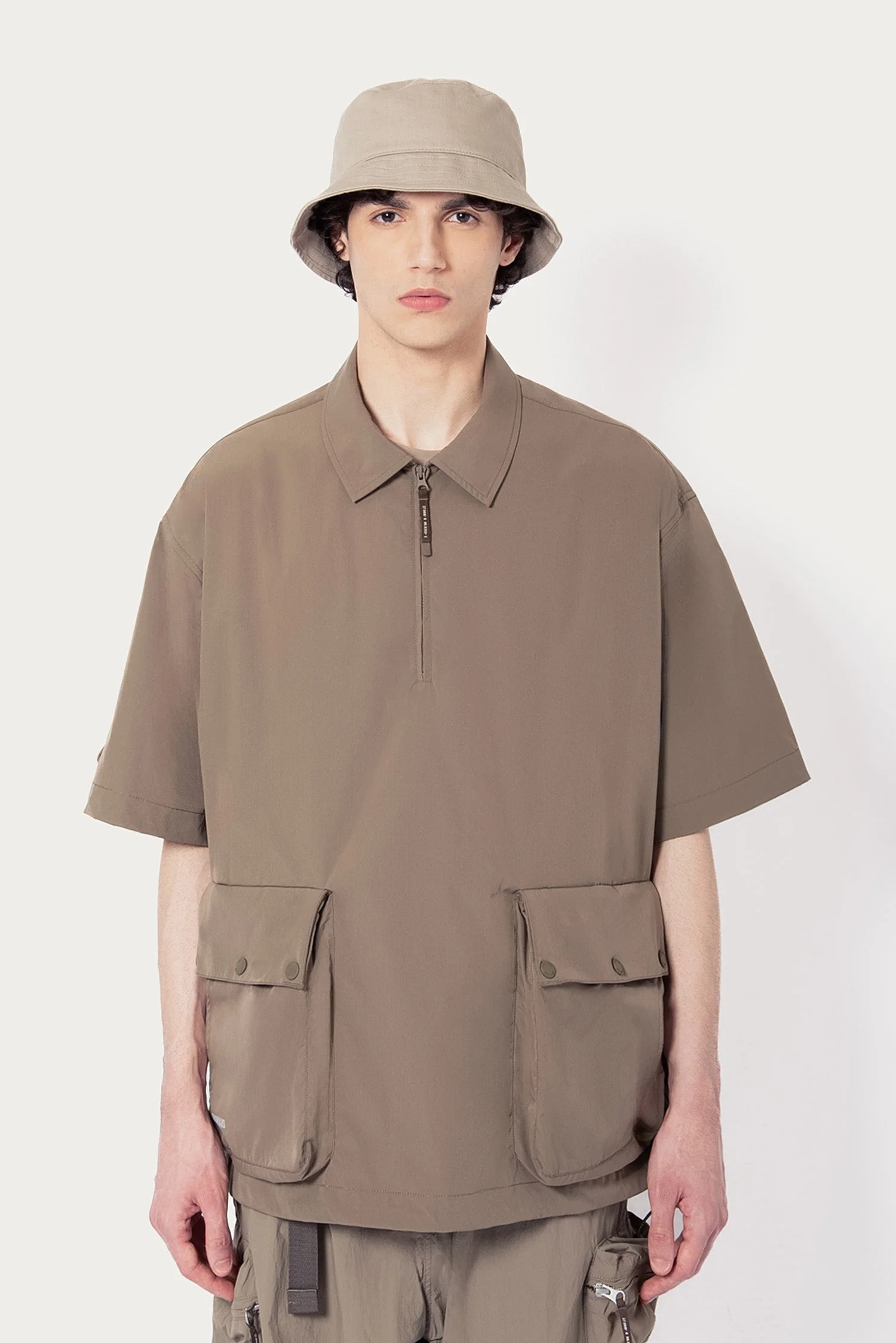 UNISEX SOLOTEX® PACKABLE HALF ZIP POLO