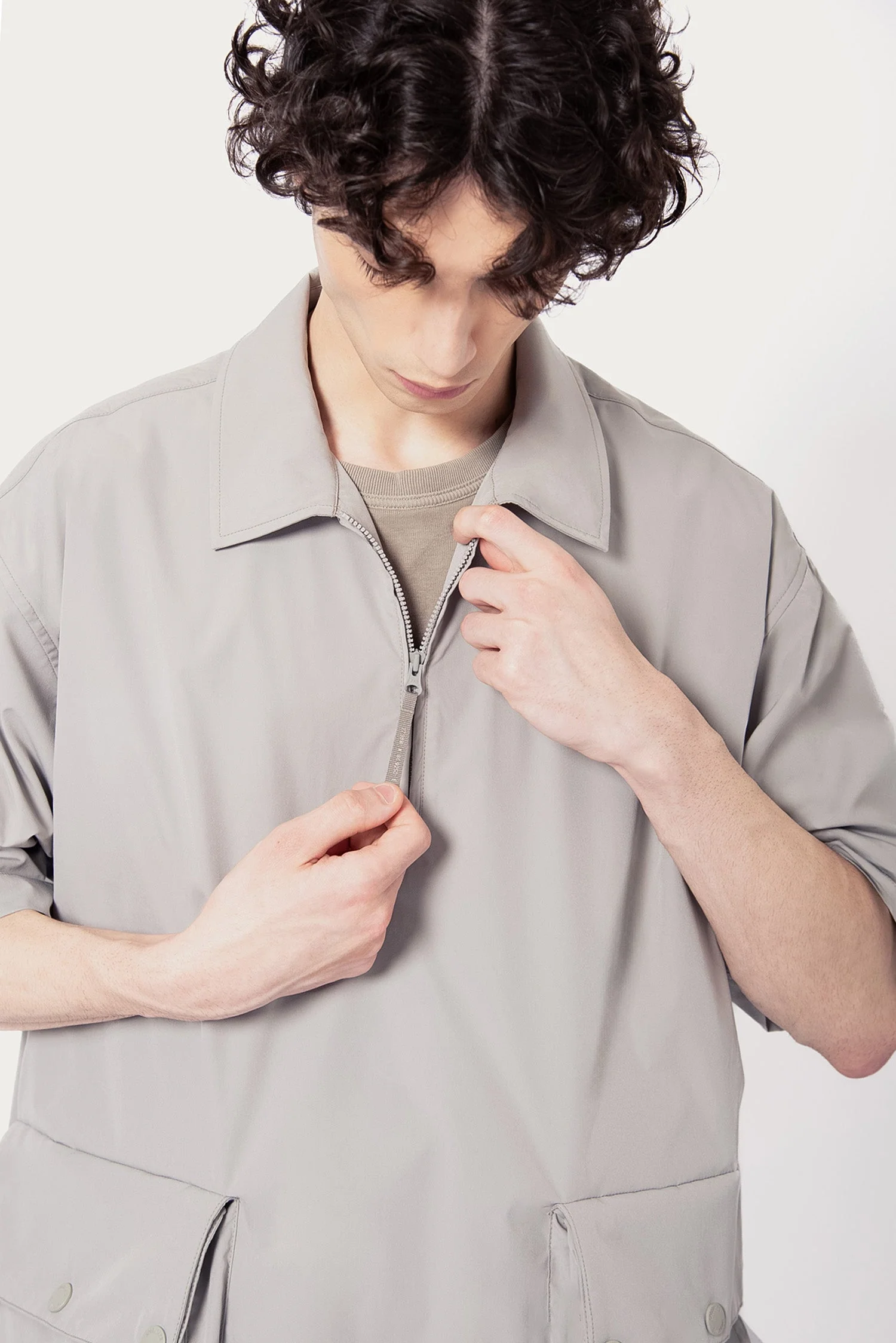 UNISEX SOLOTEX® PACKABLE HALF ZIP POLO