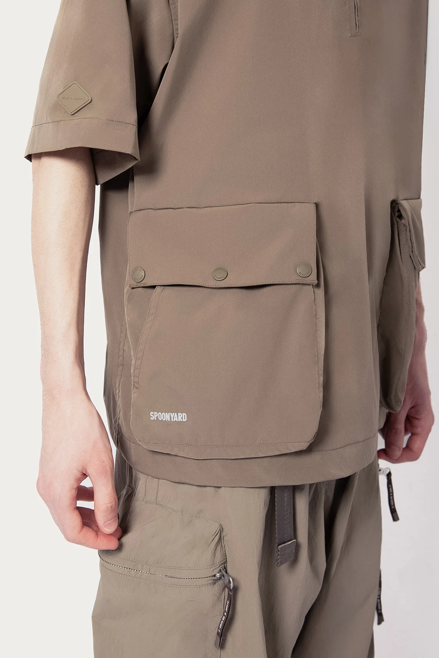 UNISEX SOLOTEX® PACKABLE HALF ZIP POLO