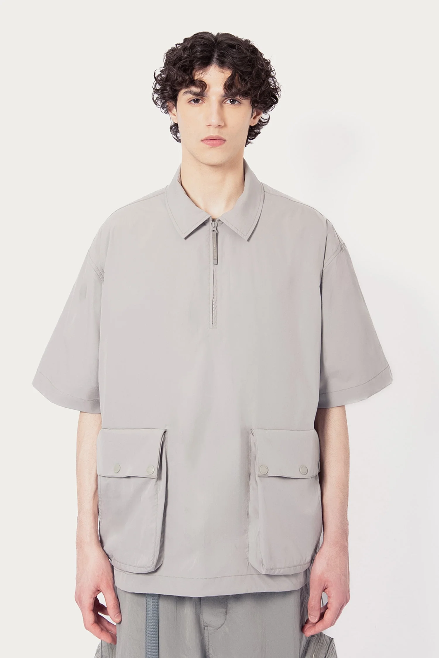 UNISEX SOLOTEX® PACKABLE HALF ZIP POLO